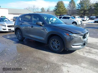 2017 Mazda CX-5 Touring with VIN JM3KFBCL3H0214881, listed as a IAAI auction lot 41694560 with 64,609 mi miles. Bid and sale history available at carsss.com. Image 1.