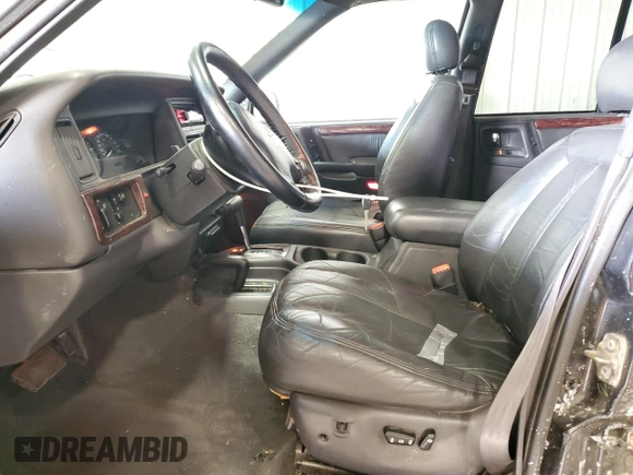 1998 Jeep Grand Cherokee Limited z VIN 1J4GZ88Z0WC276394, wystawiony jako Copart lot #46702355 z przebiegiem 144 232 mil mil oraz Szkoda całkowita • Salvage title. Historia ofert i sprzedaży dostępna na DreamBid. Obrazek 7.