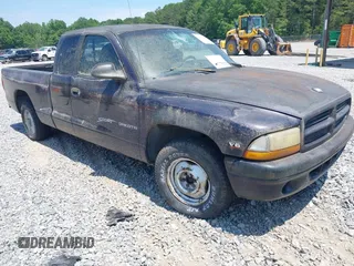 1998 Dodge Dakota SLT with VIN 1B7GL22X3WS569885, listed as a IAAI auction lot 42128994 with 1 mi miles. Bid and sale history available at carsss.com. Image 1.