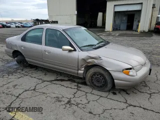1996 Ford Contour с VIN 3FALP6535TM129390, выставлен на аукционе Copart как лот 73338064 с пробегом 87 588 миль миль и Списание • Salvage title. История ставок и продаж доступна на DreamBid. Изображение 4.