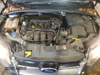 2014 Ford Focus Titanium z VIN 1FADP3N27EL462950, wystawiony jako Copart lot #65207155 z przebiegiem 34 058 mil mil oraz Szkoda całkowita • Salvage title. Historia ofert i sprzedaży dostępna na DreamBid. Obrazek 11.