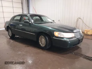 1998 Lincoln Town Car Signature with VIN 1LNFM82W8WY720232, listed as a IAAI auction lot 42125723 with 132,494 mi miles and . Bid and sale history available at DreamBid. Image 1.