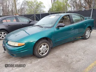 1999 Oldsmobile Alero GL z VIN 1G3NL52T7XC398799, wystawiony jako IAAI lot #41911602 z przebiegiem 252 504 mil mil oraz . Historia ofert i sprzedaży dostępna na DreamBid. Obrazek 2.