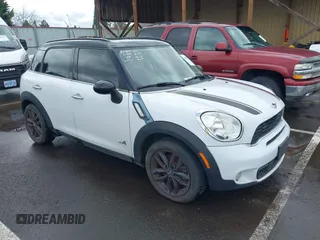 2011 MINI Countryman S with VIN WMWZC5C50BWL53497, listed as a IAAI auction lot 41805312 with 107,152 mi miles and . Bid and sale history available at DreamBid. Image 1.