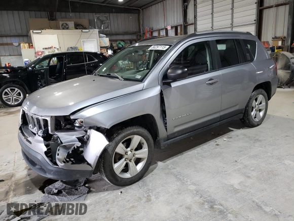2016 Jeep Compass Sport with VIN 1C4NJCBA1GD512864, listed as a Copart auction lot 56297115 with 216,693 mi miles and Salvage title. Bid and sale history available at DreamBid. Image 1.
