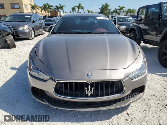 2014 Maserati Ghibli S Q4 z VIN ZAM57RTA6E1090293, wystawiony jako Copart lot #57298875 z przebiegiem 113 805 mil mil oraz Tytuł czysty. Historia ofert i sprzedaży dostępna na DreamBid. Obrazek 5.