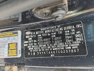 2012 Kia Sorento LX z VIN 5XYKT4A67CG237867, wystawiony jako Copart lot #59290895 z przebiegiem 276 190 mil mil oraz Szkoda całkowita • Salvage title. Historia ofert i sprzedaży dostępna na DreamBid. Obrazek 13.