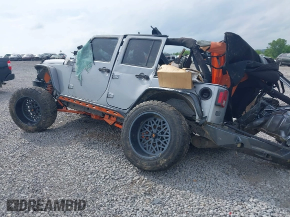 2015 Jeep Wrangler Unlimited Freedom with VIN 1C4BJWDG3FL682296, listed as a IAAI auction lot 42275536 with Not provided miles and . Bid and sale history available at DreamBid. Image 3.