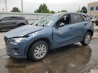 2016 Mazda CX-5 Touring z VIN JM3KE4CY2G0838020, wystawiony jako Copart lot #59036185 z przebiegiem 86 087 mil mil oraz Szkoda całkowita • Salvage title. Historia ofert i sprzedaży dostępna na DreamBid. Obrazek 1.