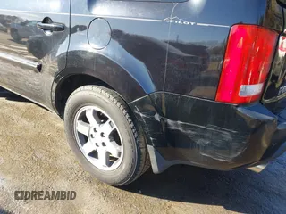 2010 Honda Pilot Touring with VIN 5FNYF4H95AB030531, listed as a IAAI auction lot 41441088 with 274,185 mi miles and . Bid and sale history available at carsss.com. Image 6.