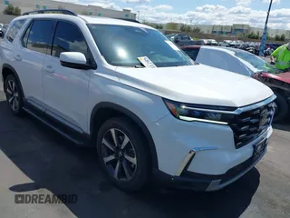 2024 Honda Pilot Touring z VIN 5FNYG1H79RB005010, wystawiony jako IAAI lot #41920666 z przebiegiem 10 117 mil mil oraz . Historia ofert i sprzedaży dostępna na DreamBid. Obrazek 1.