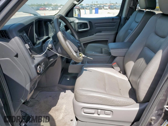 2014 Honda Ridgeline RTL z VIN 5FPYK1F53EB004694, wystawiony jako Copart lot #57222085 z przebiegiem 128 210 mil mil oraz Szkoda całkowita • Salvage title. Historia ofert i sprzedaży dostępna na DreamBid. Obrazek 7.