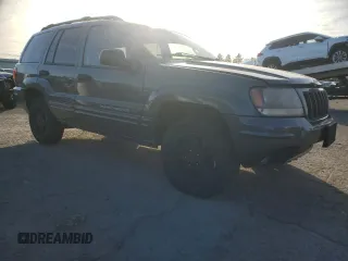 2004 Jeep Grand Cherokee with VIN 1J8GW48N24C304268, listed as a Copart auction lot 45559065 with 252,903 mi miles and Salvage title. Bid and sale history available at DreamBid. Image 4.