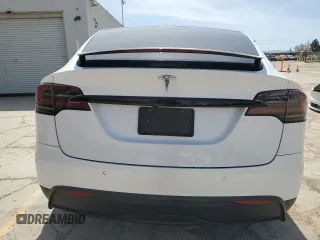 2022 Tesla Model X with VIN 7SAXCBE52NF362994, listed as a Copart auction lot 49850475 with 55,506 mi miles and Salvage Title. Bid and sale history available at DreamBid. Image 6.