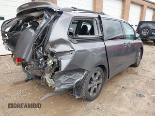 2012 Toyota Sienna SE with VIN 5TDXK3DC2CS235211, listed as a IAAI auction lot 42390354 with 242,602 mi miles and . Bid and sale history available at DreamBid. Image 4.