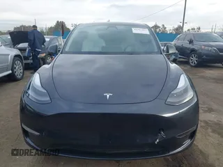 2024 Tesla Model Y with VIN 7SAYGDED8RF116209, listed as a IAAI auction lot 41761804 with 12,048 mi miles and . Bid and sale history available at DreamBid. Image 12.