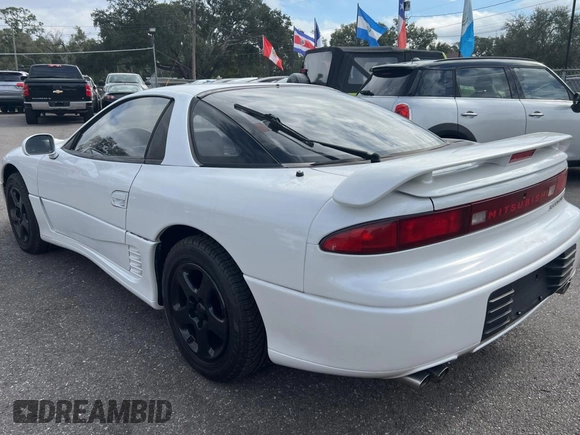 1992 Mitsubishi 3000GT z VIN JA3XE74CXNY058167, wystawiony jako Copart lot #84192254 z przebiegiem 69 411 mil mil oraz Czysty tytuł • Clean title. Historia ofert i sprzedaży dostępna na DreamBid. Obrazek 3.