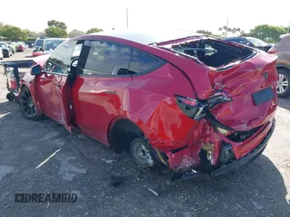 2022 Tesla Model Y Long Range z VIN 7SAYGDEE1NF385414, wystawiony jako IAAI lot #41660542 z przebiegiem 54 075 mil mil oraz . Historia ofert i sprzedaży dostępna na DreamBid. Obrazek 3.