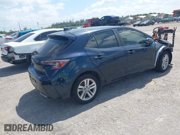 2019 Toyota Corolla Hatchback SE with VIN JTNK4RBE3K3061589, listed as a IAAI auction lot 42123273 with 90,491 mi miles. Bid and sale history available at carsss.com. Image 4.