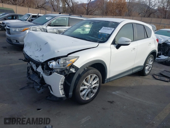 2015 Mazda CX-5 Grand Touring with VIN JM3KE4DY3F0483629, listed as a IAAI auction lot 41054059 with 118,980 mi miles. Bid and sale history available at carsss.com. Image 16.