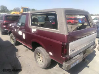 1990 Ford Bronco XL with VIN 1FMEU15N7LLA25223, listed as a IAAI auction lot 41858217 with 196,000 mi miles. Bid and sale history available at carsss.com. Image 3.