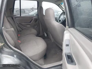2004 Jeep Grand Cherokee Laredo with VIN 1J4GX48S14C177923, listed as a IAAI auction lot 41745772 with 242,506 mi miles. Bid and sale history available at carsss.com. Image 8.