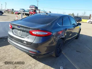 2015 Ford Fusion S Hybrid with VIN 3FA6P0UU2FR105754, listed as a IAAI auction lot 41631104 with 185,114 mi miles. Bid and sale history available at carsss.com. Image 4.