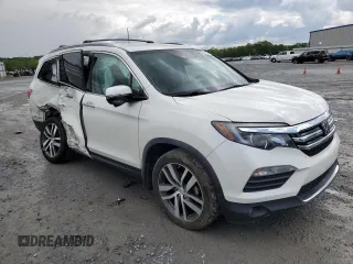 2017 Honda Pilot Touring with VIN 5FNYF6H91HB092062, listed as a Copart auction lot 52761765 with 141,750 mi miles and Salvage Title. Bid and sale history available at DreamBid. Image 4.