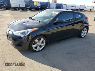 2012 Hyundai Veloster w/Red Int with VIN KMHTC6AD2CU065143, listed as a Copart auction lot 87262524 with 111,448 mi miles and Clean title. Bid and sale history available at DreamBid. Image 1.