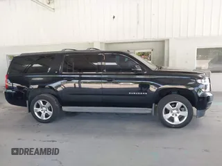 2015 Chevrolet Suburban LT with VIN 1GNSKJKC7FR199544, listed as a IAAI auction lot 42169017 with 219,219 mi miles and . Bid and sale history available at DreamBid. Image 13.