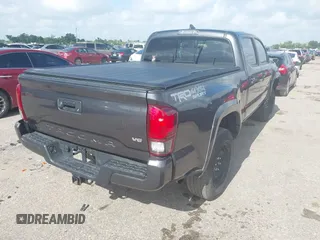 2018 Toyota Tacoma SR5 with VIN 3TMDZ5BN0JM051283, listed as a IAAI auction lot 42438690 with 106,155 mi miles and . Bid and sale history available at DreamBid. Image 4.