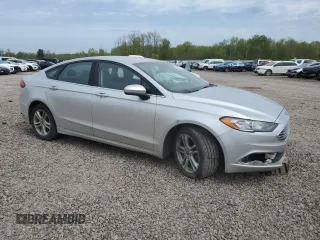 2018 Ford Fusion SE z VIN 3FA6P0H74JR112086, wystawiony jako Copart lot #56630275 z przebiegiem 123 300 mil mil oraz Szkoda całkowita • Salvage title. Historia ofert i sprzedaży dostępna na DreamBid. Obrazek 4.