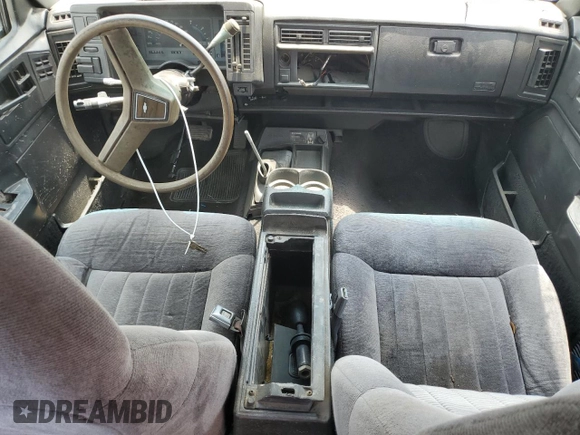 1994 GMC Jimmy Diamond Edition Luxury z VIN 1GKDT13W5R2503916, wystawiony jako Copart lot #54717215 z przebiegiem 99 991 mil mil oraz Szkoda całkowita • Salvage title. Historia ofert i sprzedaży dostępna na DreamBid. Obrazek 8.