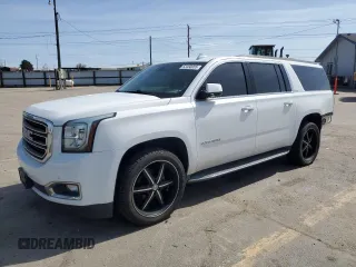 2016 GMC Yukon XL SLT with VIN 1GKS2GKC6GR228033, listed as a Copart auction lot 52450055 with 135,476 mi miles and Salvage Title. Bid and sale history available at carsss.com. Image 1.