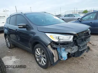 2017 Ford Escape Titanium z VIN 1FMCU0JD9HUE03672, wystawiony jako IAAI lot #42411549 z przebiegiem 89 846 mil mil oraz . Historia ofert i sprzedaży dostępna na DreamBid. Obrazek 1.