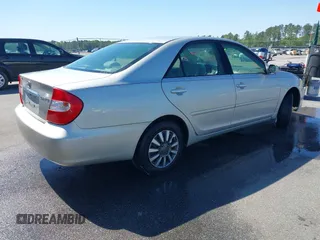 2004 Toyota Camry LE with VIN 4T1BE32K04U319290, listed as a IAAI auction lot 42019125 with 304,666 mi miles. Bid and sale history available at carsss.com. Image 4.