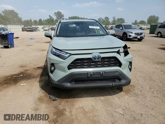2022 Toyota RAV4 Hybrid XLE Premium with VIN 4T3B6RFV8NU101319, listed as a Copart auction lot 60987535 with 100,070 mi miles and Salvage title. Bid and sale history available at DreamBid. Image 14.