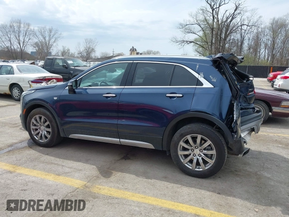 2021 Cadillac XT4 AWD Premium Luxury z VIN 1GYFZDR45MF048569, wystawiony jako IAAI lot #41902941 z przebiegiem 53 891 mil mil oraz . Historia ofert i sprzedaży dostępna na DreamBid. Obrazek 14.