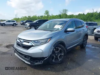 2018 Honda CR-V Touring with VIN 7FARW1H90JE012526, listed as a IAAI auction lot 42055078 with 96,098 mi miles and . Bid and sale history available at DreamBid. Image 2.