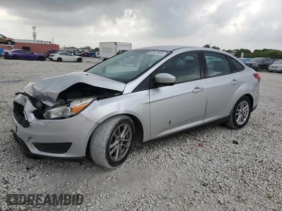 2018 Ford Focus SE with VIN 1FADP3F28JL256318, listed as a Copart auction lot 55524544 with 136,723 mi miles and Salvage title. Bid and sale history available at DreamBid. Image 1.