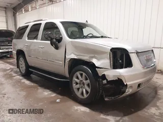 2014 GMC Yukon Denali with VIN 1GKS2EEF0ER134804, listed as a IAAI auction lot 41582709 with 142,192 mi miles. Bid and sale history available at carsss.com. Image 1.
