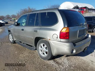 2003 GMC Envoy SLE with VIN 1GKDT13S732168534, listed as a IAAI auction lot 38049193 with 230,894 mi miles. Bid and sale history available at carsss.com. Image 3.