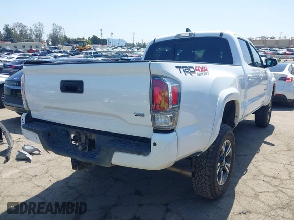 2021 Toyota Tacoma 4WD SR5 with VIN 3TMDZ5BN4MM106693, listed as a IAAI auction lot 41986838 with 52,510 mi miles. Bid and sale history available at carsss.com. Image 4.