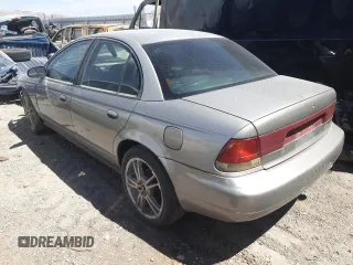 1999 Saturn SL z VIN 1G8ZK5271XZ316032, wystawiony jako Copart lot #50663015 z przebiegiem 164 288 mil mil oraz Nie do naprawy. Historia ofert i sprzedaży dostępna na DreamBid. Obrazek 2.