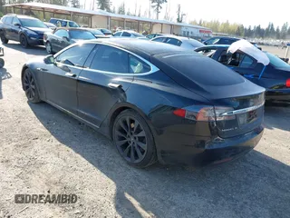 2018 Tesla Model S 75D with VIN 5YJSA1E28JF273809, listed as a IAAI auction lot 42029434 with 85,972 mi miles and . Bid and sale history available at DreamBid. Image 3.