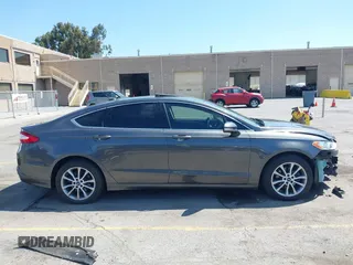 2015 Ford Fusion SE with VIN 3FA6P0HD4FR238607, listed as a IAAI auction lot 42685572 with 132,843 mi miles and . Bid and sale history available at DreamBid. Image 14.