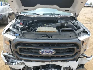 2023 Ford F-150 XL with VIN 1FTEW1EP7PFB66555, listed as a Copart auction lot 59384665 with 28,495 mi miles and Salvage title. Bid and sale history available at DreamBid. Image 11.