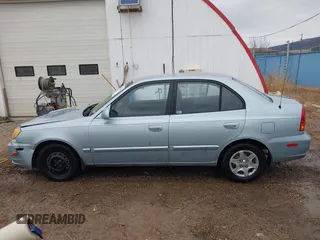 2003 Hyundai Accent GL with VIN KMHCG45C43U465523, listed as a IAAI auction lot 40883056 with 95,770 mi miles. Bid and sale history available at carsss.com. Image 14.