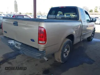 2000 Ford F-150 XL with VIN 1FTZX1723YKB48613, listed as a IAAI auction lot 41611851 with 187,450 mi miles. Bid and sale history available at carsss.com. Image 4.