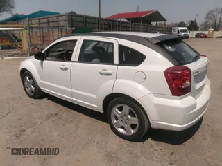 2009 Dodge Caliber SXT with VIN 1B3HB48A19D259105, listed as a IAAI auction lot 41881974 with 127,096 mi miles and . Bid and sale history available at DreamBid. Image 3.